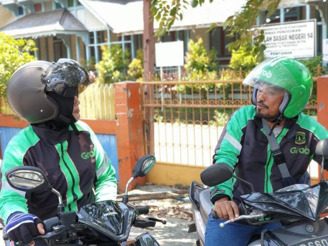 Banjir, Layanan Grab Tetap Beroperasi